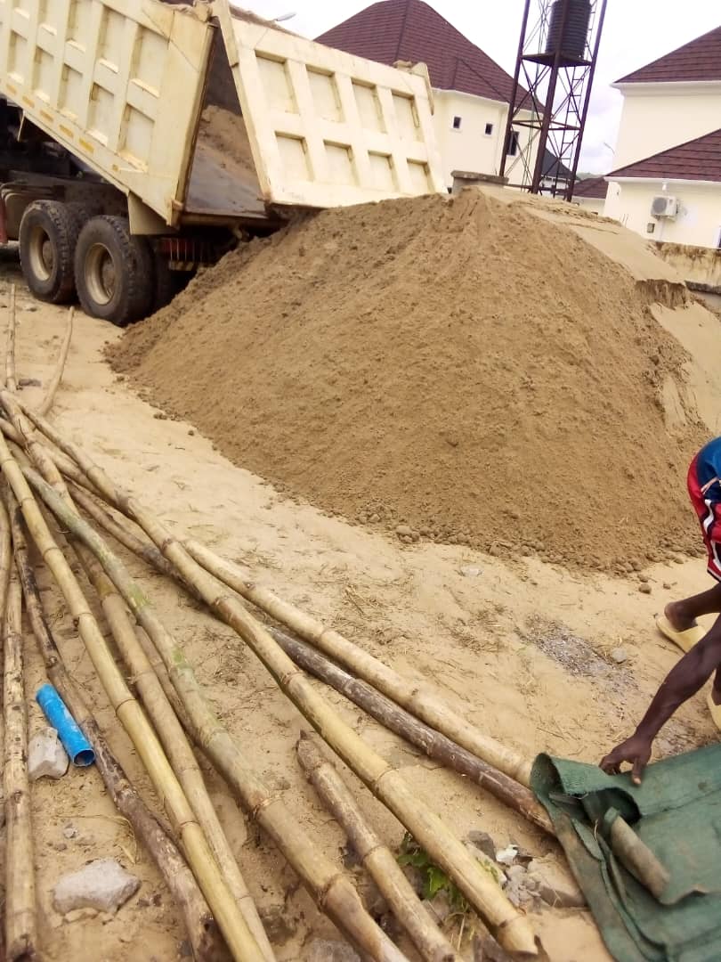 Tipper truck delivering sharp sand